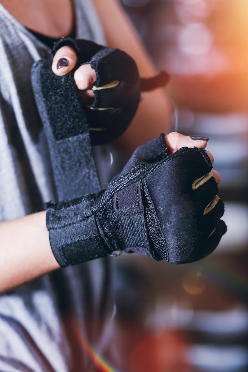 person wearing black fingerless gloves