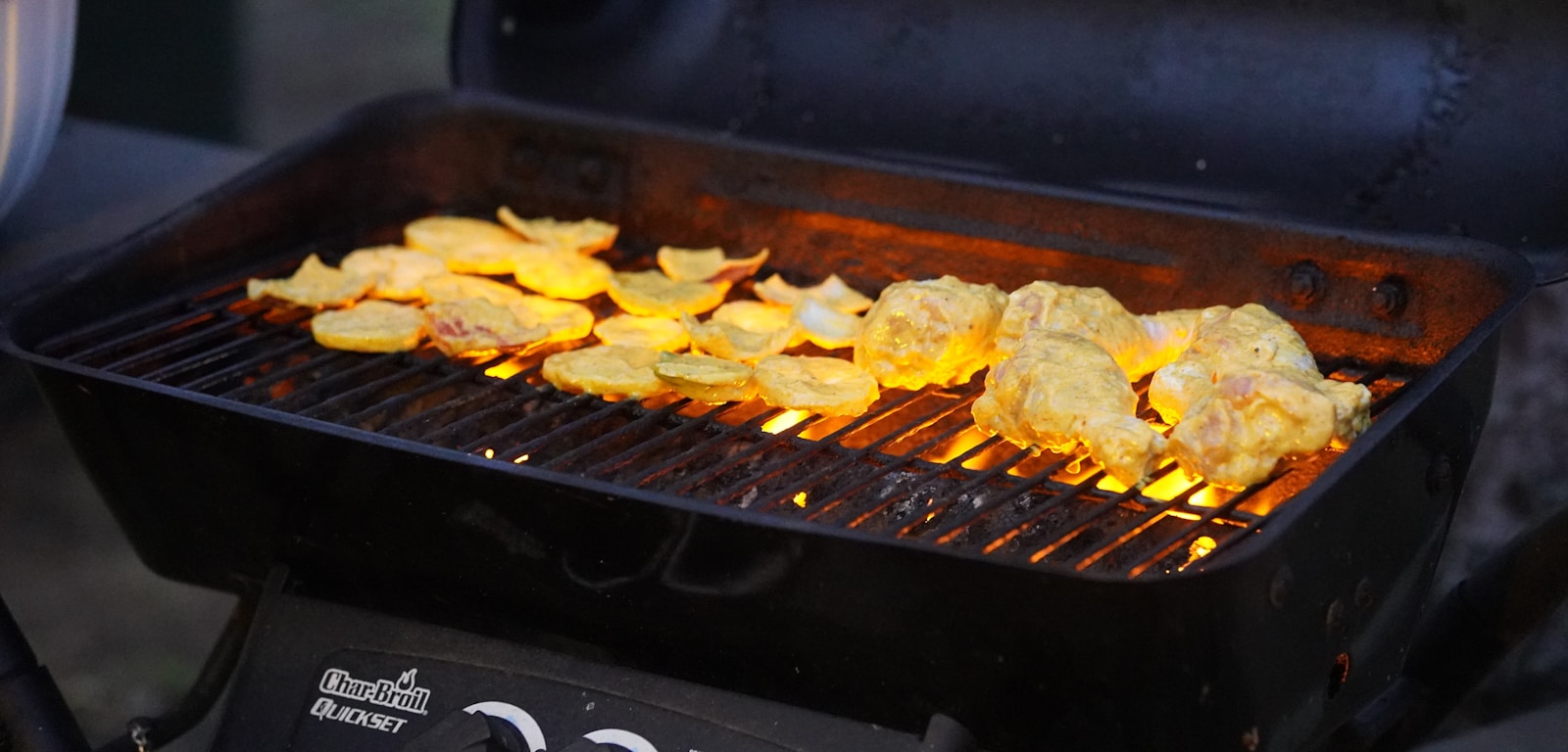 a grill with food cooking on top of it